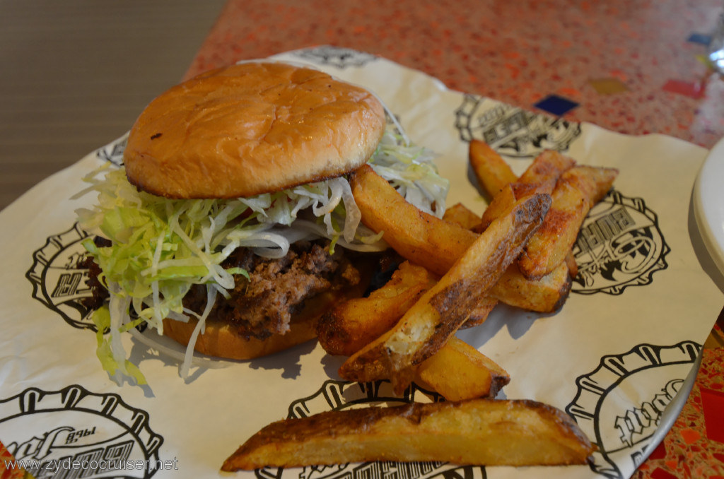 194: Carnival Conquest, Belize, A Guy's Burger Joint burger and fries. They come with cheese by default, so if you don't want cheese, order one without cheese.
